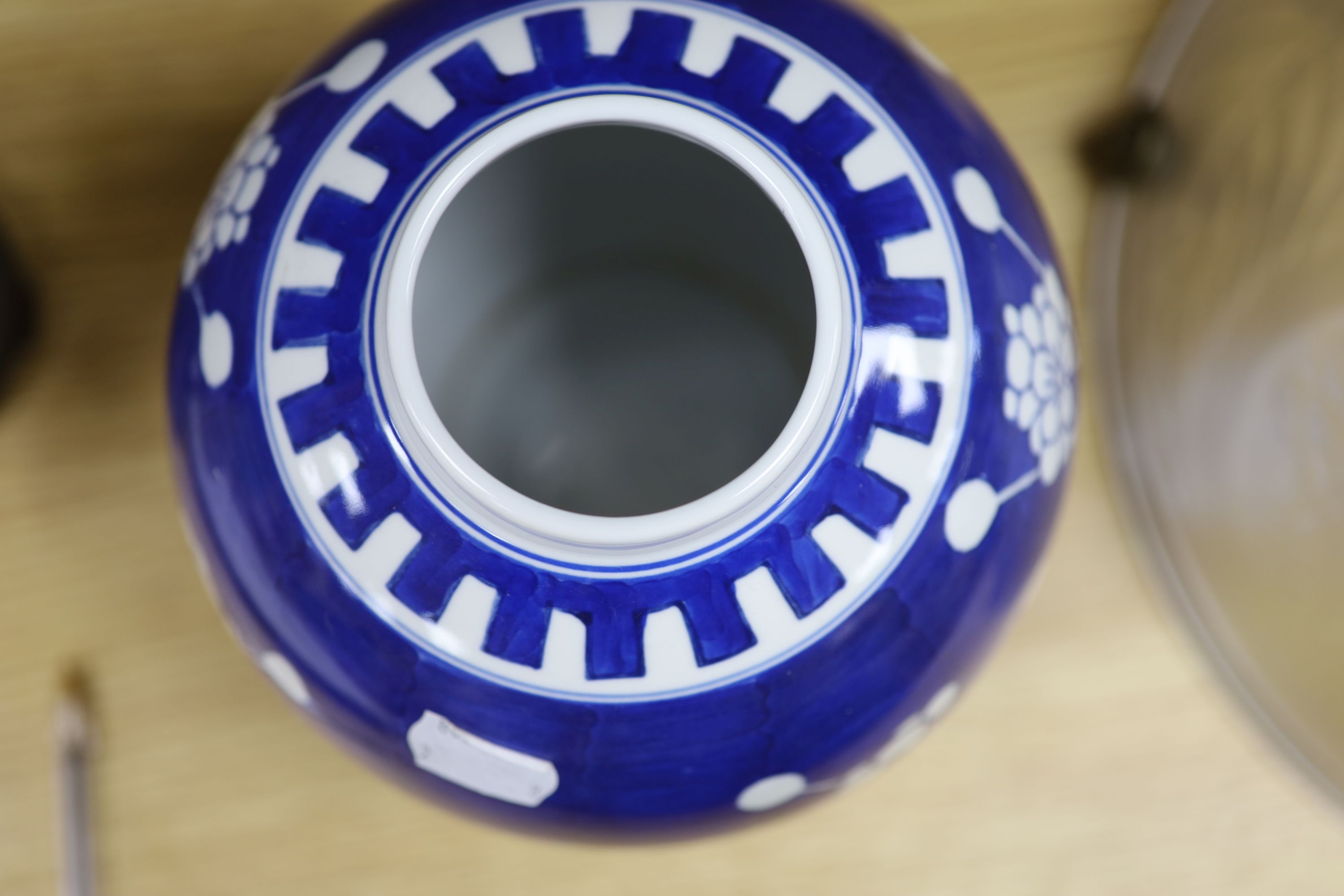 A Chinese blue and white cylindrical vase, another vase and cover and a blue and white jar and cover, together with a cloisonne vase and a bronze censer, tallest 32cm